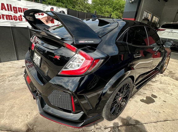 black car with rear spoiler